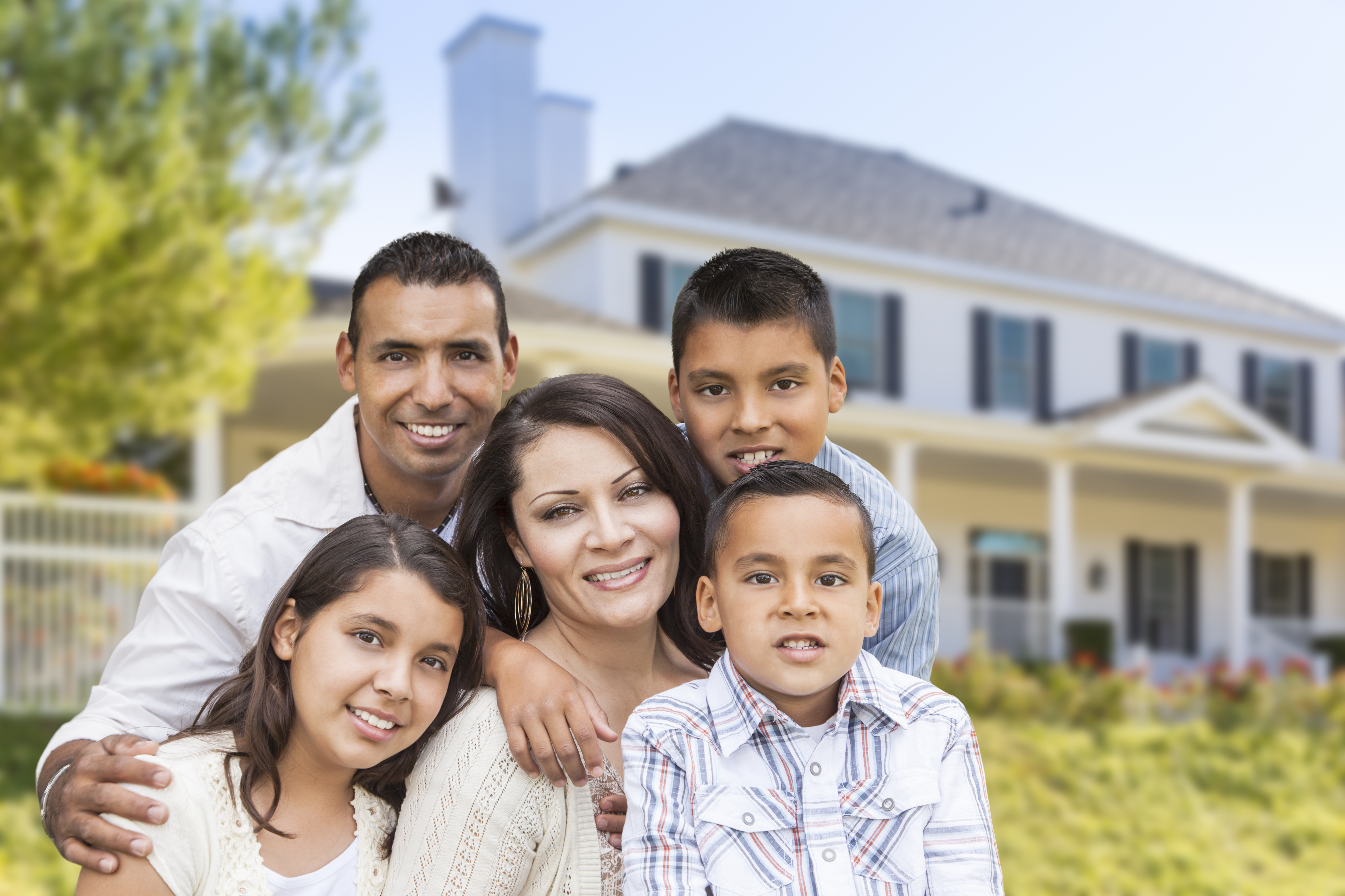 Family in front of home